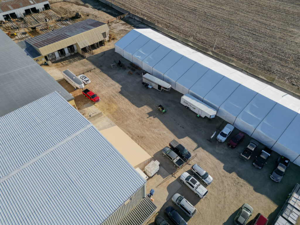 Aerial (drone) view of 60′ x 230′ (18m x 70m) Losberger clearspan event structure Waverly Sales Co., in Waverly, IA