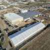 Aerial (drone) view of 60′ x 230′ (18m x 70m) Losberger clearspan event structure Waverly Sales Co., in Waverly, Iowa