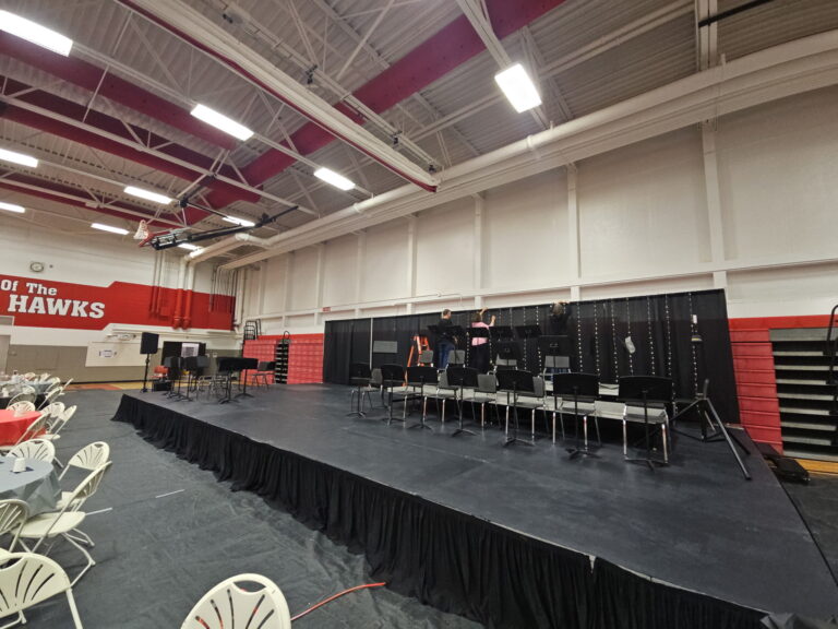 20' x 40' stage with a pipe and drape backdrop at Iowa City High School in Iowa City, IA