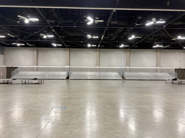 Front view of three towable bleachers for the 2026 USA Gymnastics event at RiverCenter in Davenport, Iowa