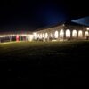 10′ x 30′ frame tent between a 40′ x 120′ Jumbo Track event tent on the far left to the 30′ x 75′ frame tent on the right with French windows.