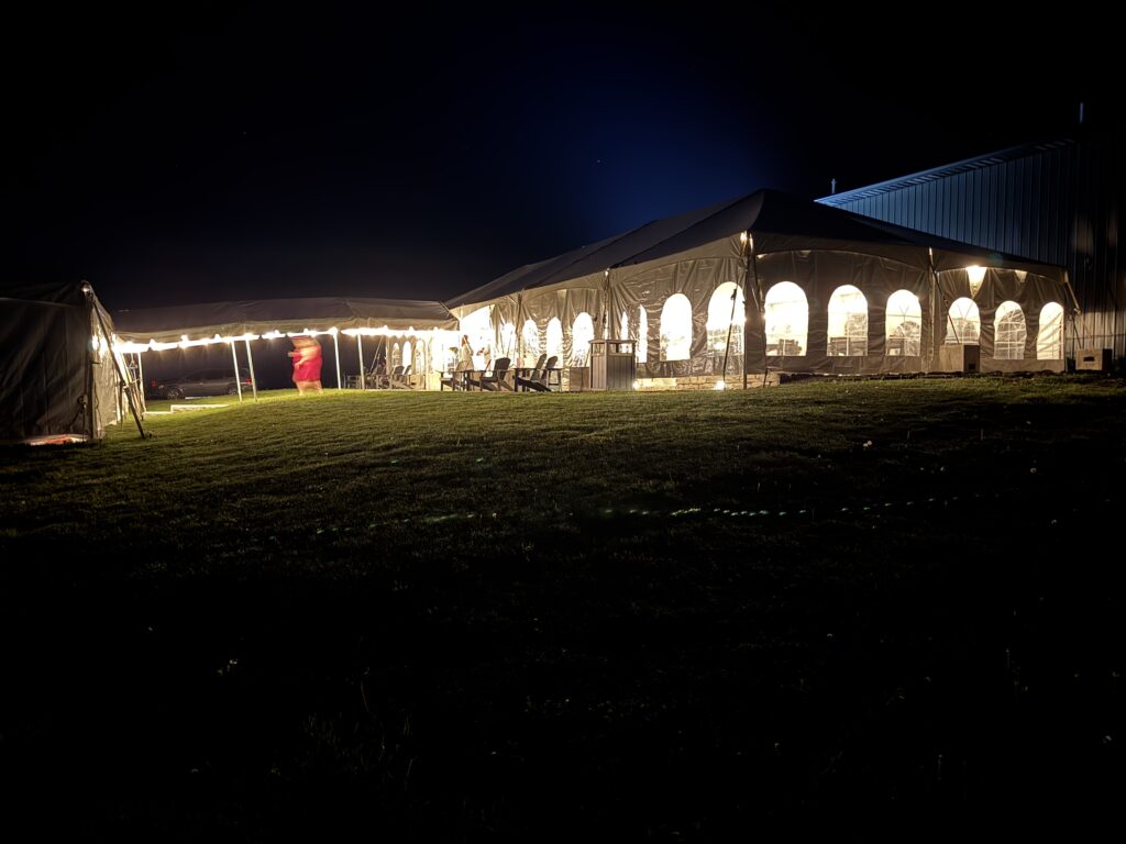 10′ x 30′ frame tent between a 40′ x 120′ Jumbo Track event tent on the far left to the 30′ x 75′ frame tent on the right with French windows.