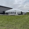 30′ x 75′ Frame Tent on the left with 10′ x 30′ Frame Tent off of it.