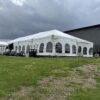 30′ x 75′ frame tent with a 10′ x 30′ frame tent off the left side.