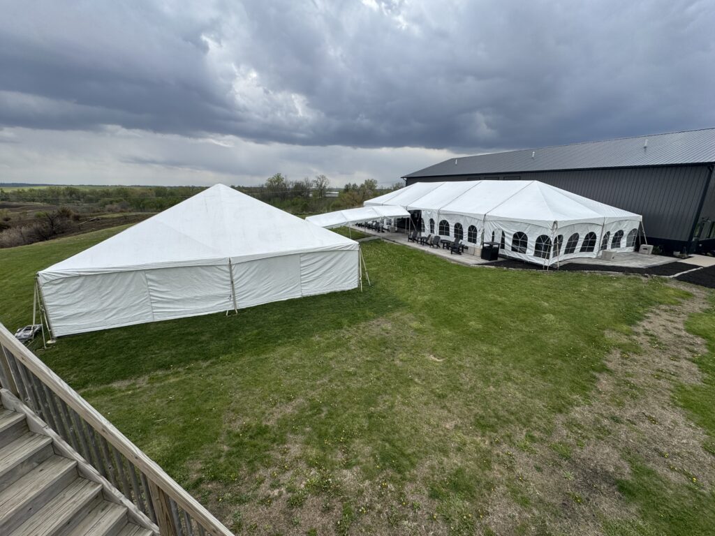 40′ x 120′ hybrid tent on the left with 10′ x 30′ frame tent walkway into 30′ x 75′ frame tent at Legacy Acres Hunting Club in Parnell, Iowa.