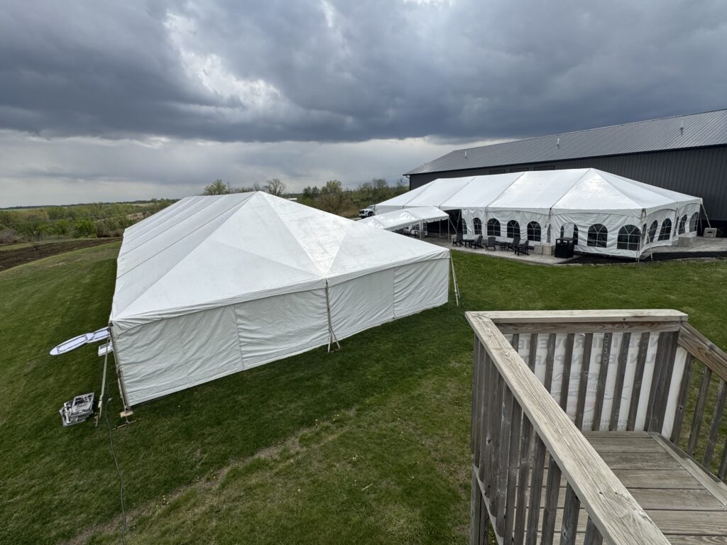 40′ x 120′ hybrid tent on the left with 10′ x 30′ frame tent walkway into 30′ x 75′ frame tent at Legacy Acres Hunting Club in Parnell, Iowa.