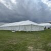 Back of 40′ x 120′ Hybrid Tent on the left with a 30′ x 75′ Frame Tent in the background.