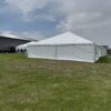 Corner of 40′ x 120′ Hybrid Tent with a 30′ x 75′ Frame Tent in the background.