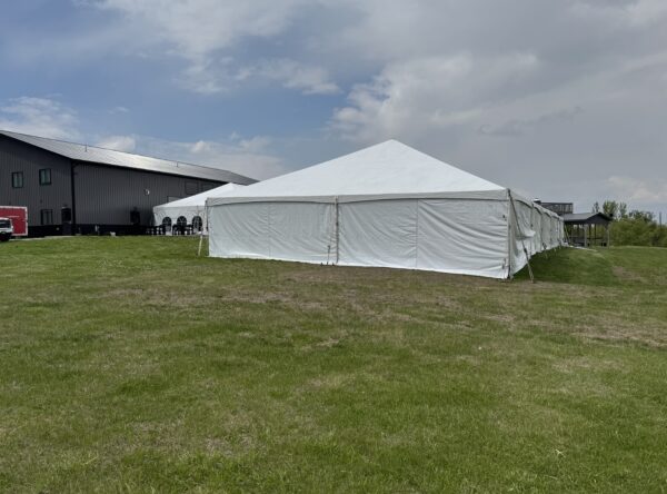 Corner of 40′ x 120′ Hybrid Tent with a 30′ x 75′ Frame Tent in the background. Corner of 40′ x 120′ Hybrid Tent with a 30′ x 75′ Frame Tent in the background.