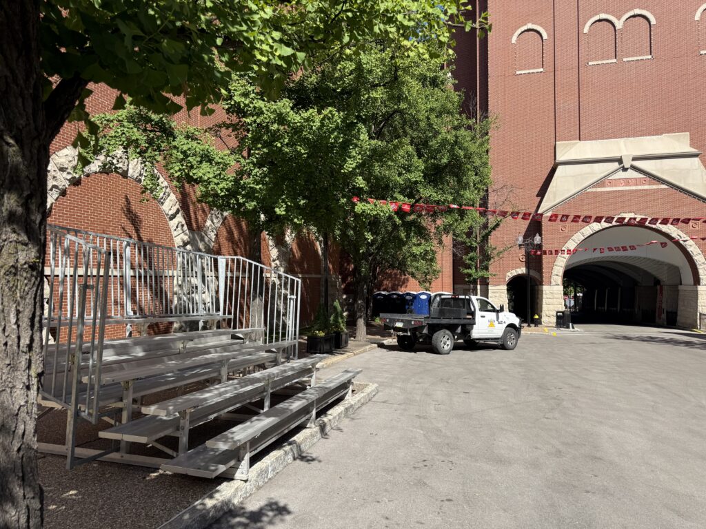 One of our 5-Row Bleachers with railing outside of the Budweiser building for the 150th Anniversary Celebration in St. Louis, Missouri with a company truck