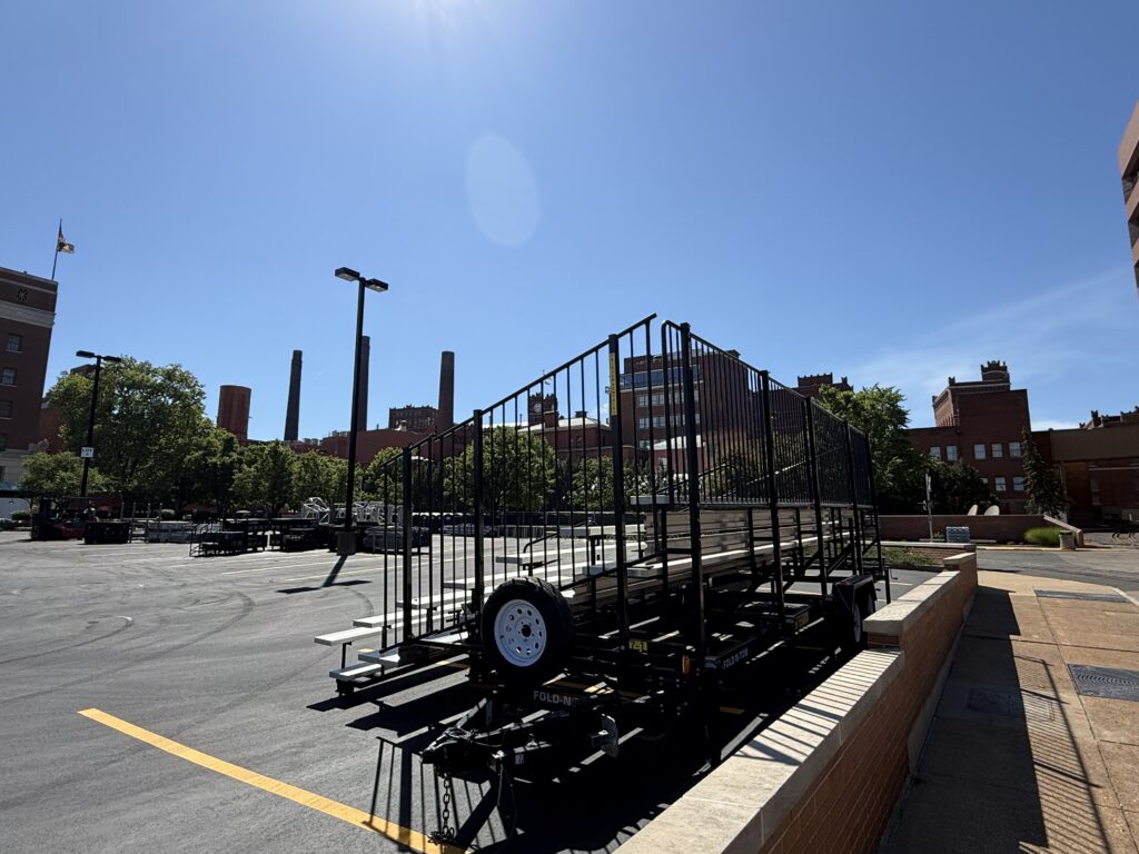 Side and back of one 7-Row towable bleacher outside of the Budweiser building for the 150th anniversary celebration in St. Louis, Missouri