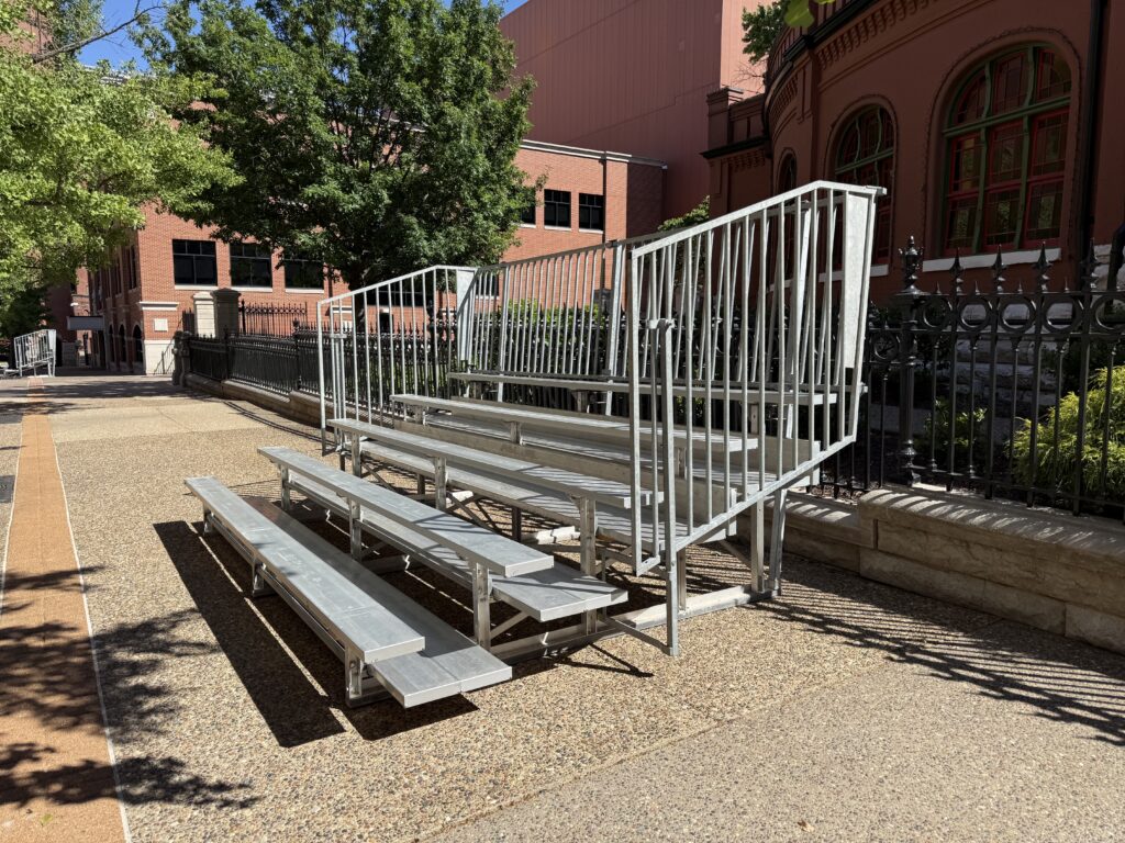 Side of a 5-Row Bleachers with railing outside of the Budweiser building for the 150th Anniversary Celebration in St. Louis, Missouri