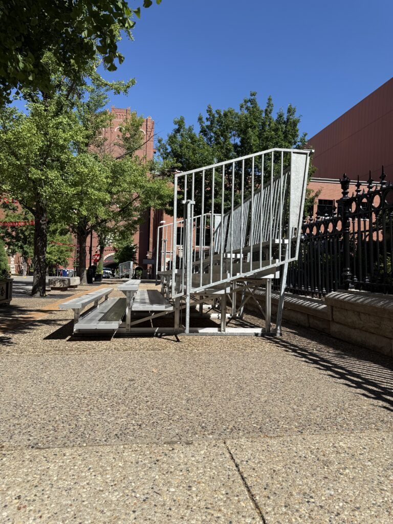 Side of a 5-Row Bleachers with railing outside of the Budweiser building for the 150th Anniversary Celebration in St. Louis, Missouri