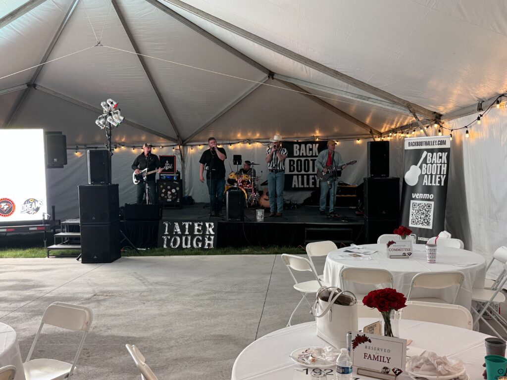 Stage under event tent.