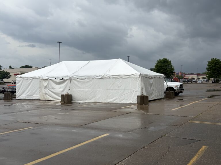 20' x 40' Frame Tent with tables for TNT Fireworks at a Walmart parking lot in Moline, Illinois