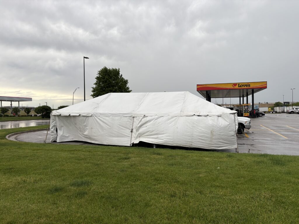 20' x 40' frame tent setup in the Quad Cities. White sidewalls installed for TNT Fireworks to protect inventory and customers from rain or wind — fully adjustable based on weather conditions.