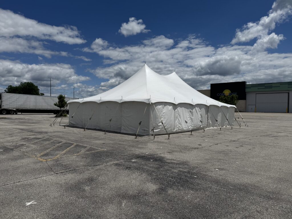 30' x 40' Rope & Pole Tent Setup on Asphalt at Coral Ridge Mall for TNT Fireworks (mall sign)