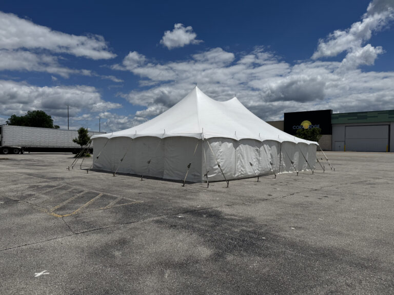 30' x 40' Rope & Pole Tent Setup on Asphalt at Coral Ridge Mall for TNT Fireworks (mall sign)