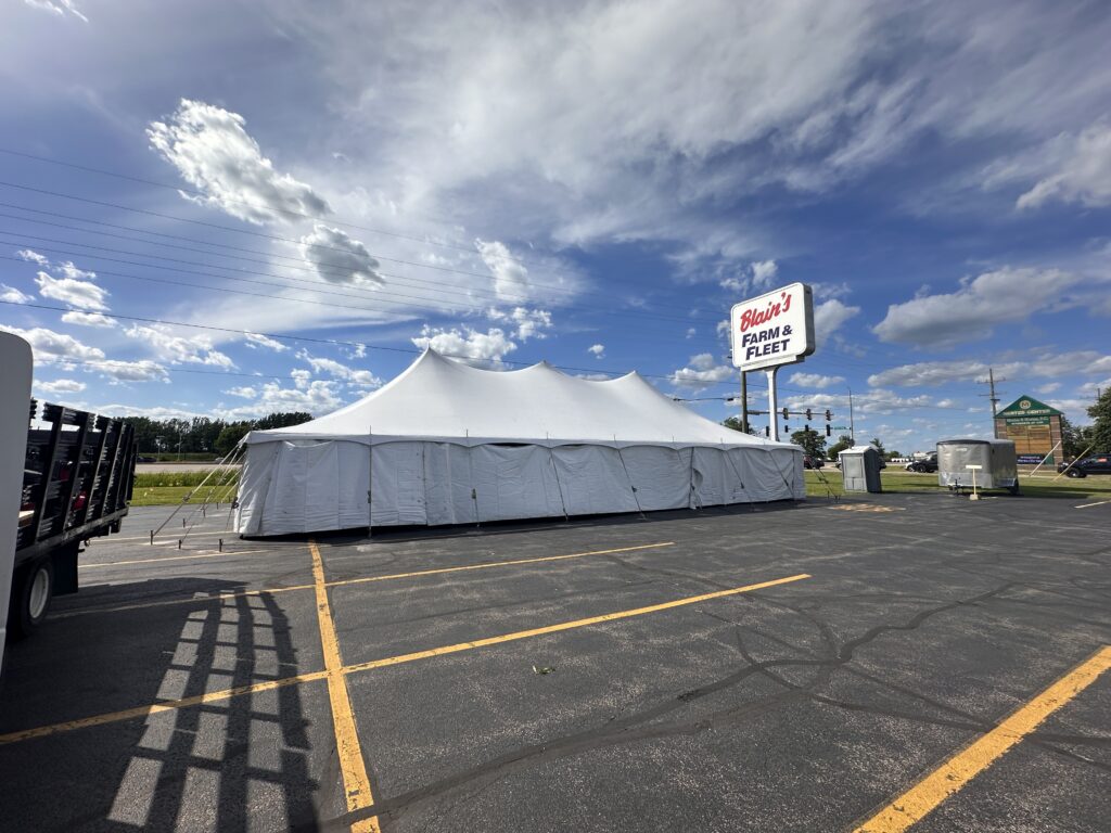 30' x 60' Rope and Pole Tent in Sterling, Illinois for Cornellier Fireworks with Blair's Farm & Fleet sign
