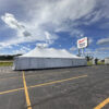 30' x 60' Rope and Pole Tent in Sterling, Illinois for Cornellier Fireworks with Blair's Farm & Fleet sign (edit)