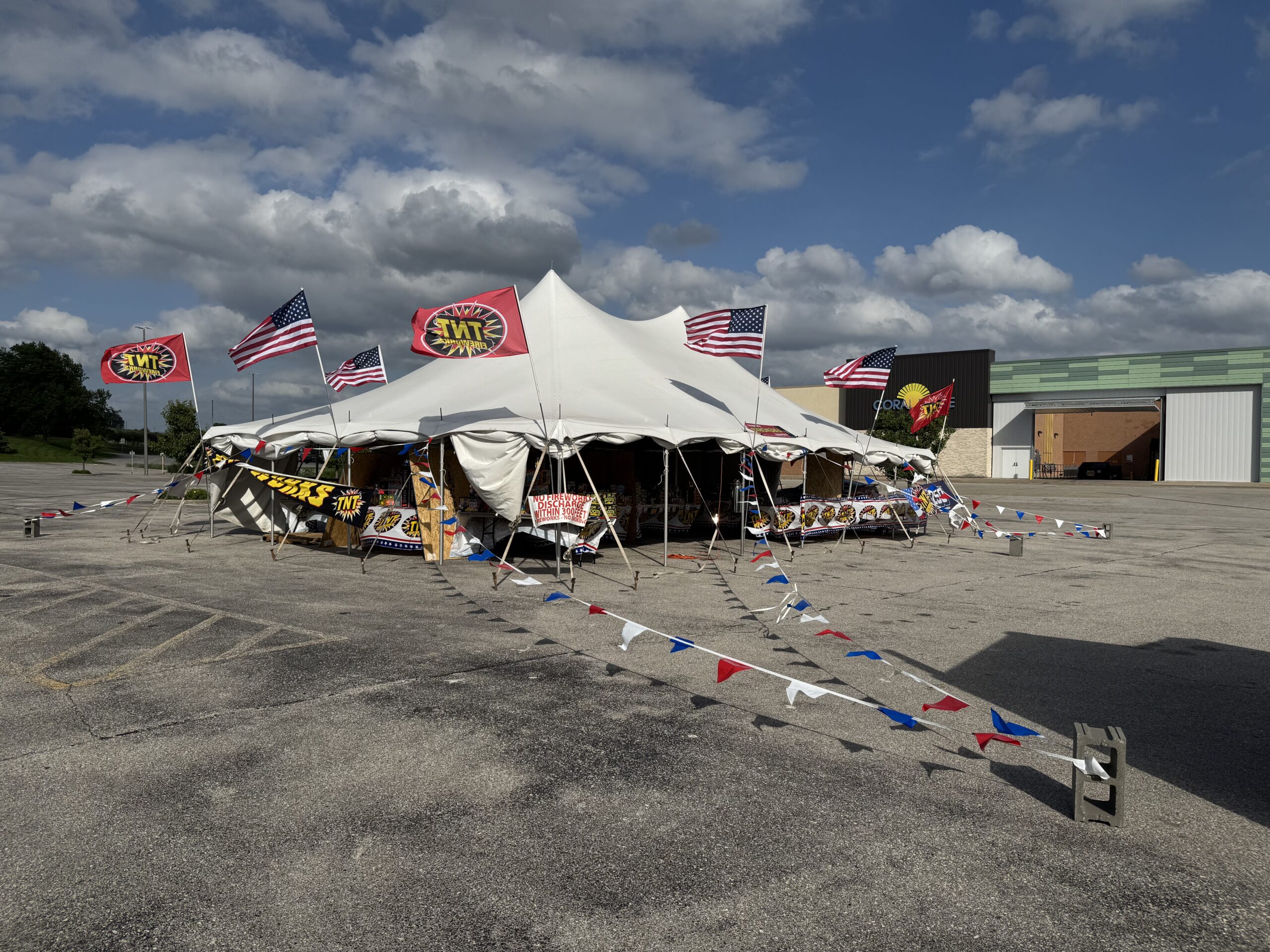 30′ x 40′ Rope & Pole Tent Setup on Asphalt at Coral Ridge Mall for TNT Fireworks (open for business)