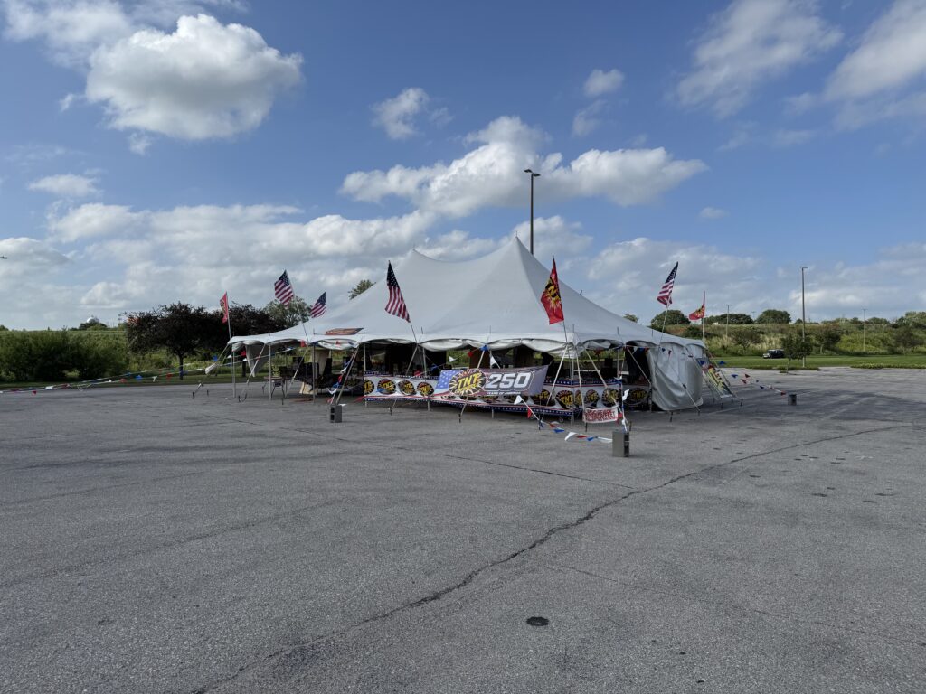 30′ x 40′ Rope & Pole Tent Setup on Asphalt at Coral Ridge Mall for TNT Fireworks (open for business) sky