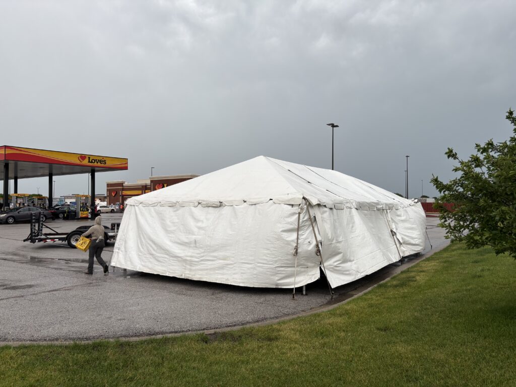 Full white sidewalls keep weather out while providing 800 sq ft of protected retail space. Sidewalls can easily be removed or pulled back for better airflow on nicer days.