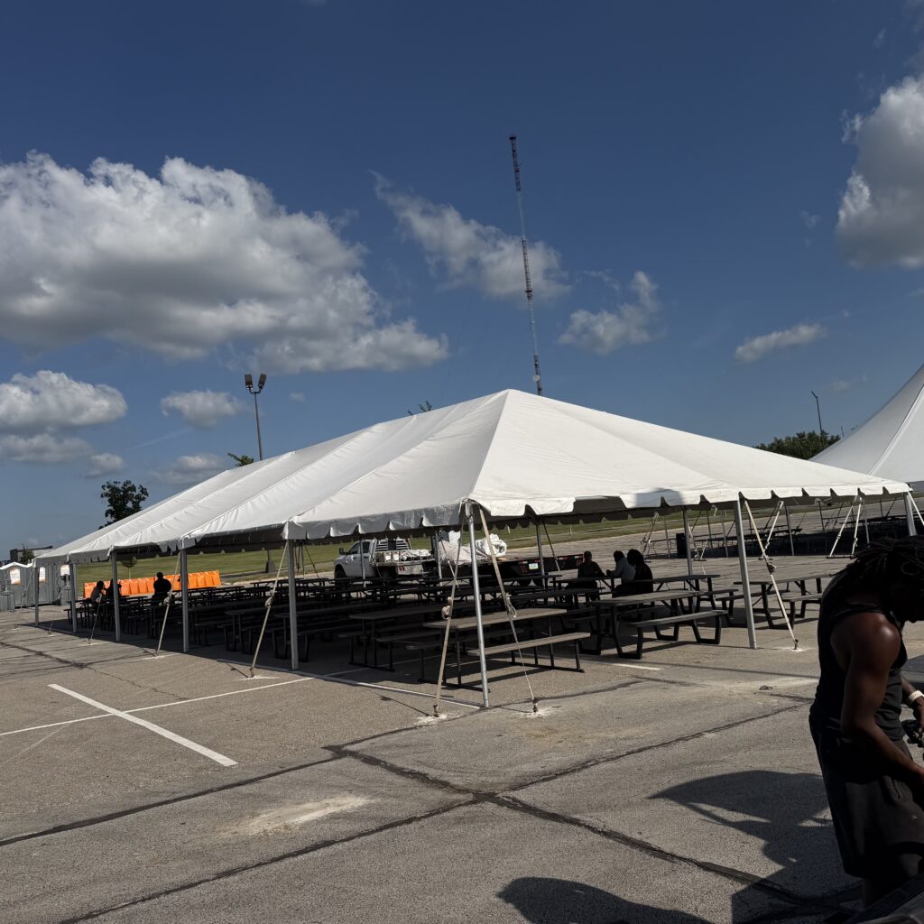 30' x 75' frame tent with folding picnic tables in Cedar Rapids, Iowa