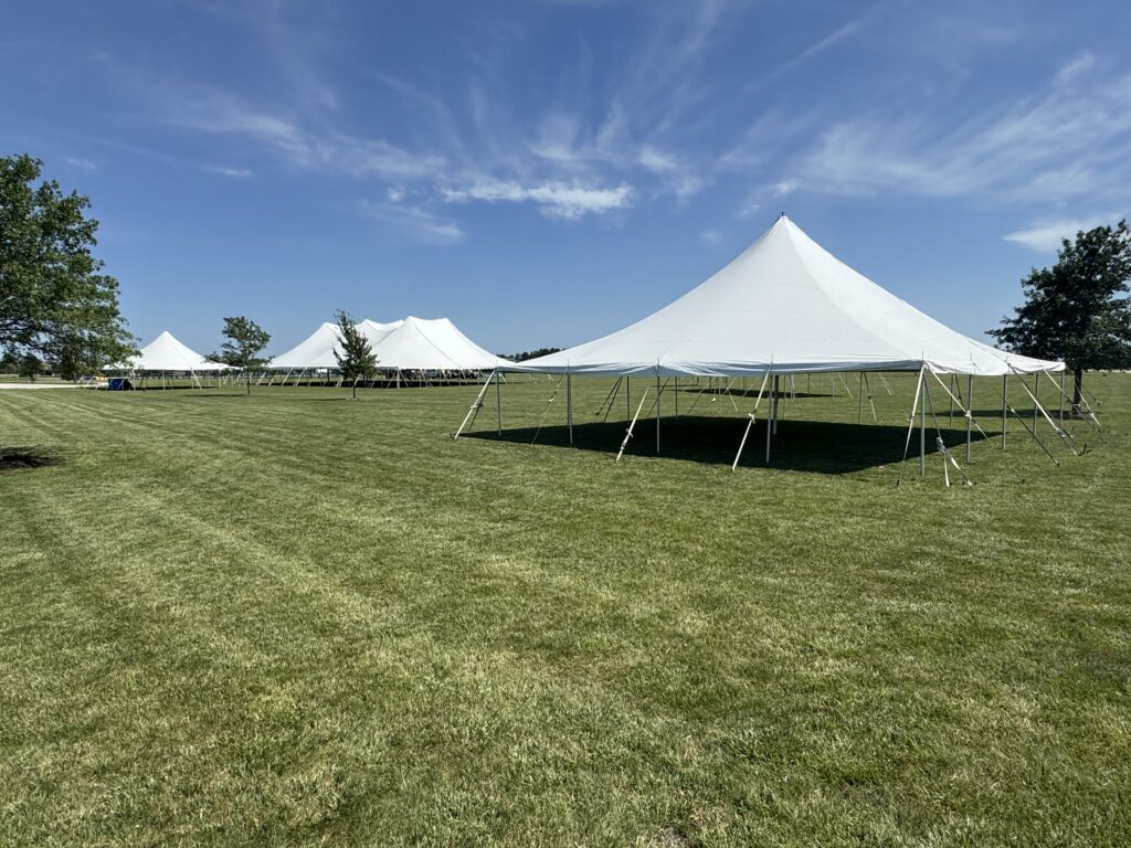 A 80′ x 120′ Rope and Pole Tent in the middle of two 40′ x 40′ Fred’s Rope and Pole Tents at North Liberty Blues & BBQ at Centennial Park in 2026