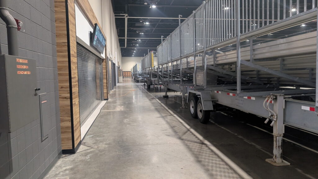 Back of towable bleacher trailers lined up in Schaumburg Convention Center