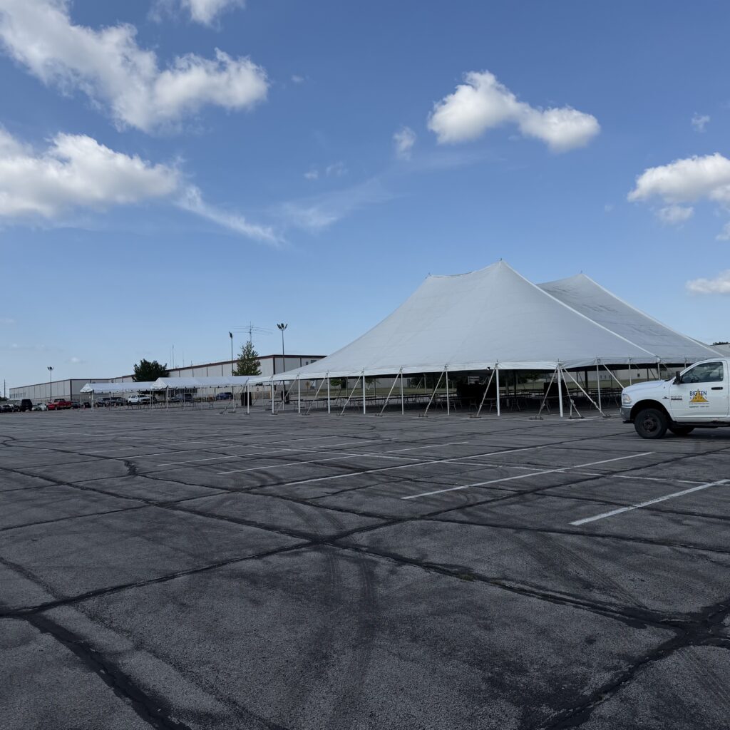 Two frame tents on the far left and a 80' x 90' rope and pole tent on the right in Cedar Rapids, Iowa