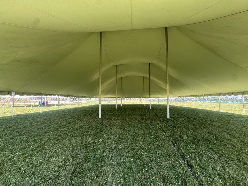 Under the 80′ x 120′ Rope and Pole Tent with 9,600 ft² (at the end)
