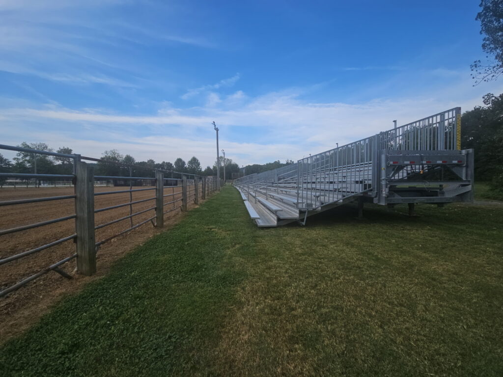 10-row 45-foot towable bleacher set along the arena fence at Liberty Field in Pacific, Missouri for the Iron Horse Rodeo