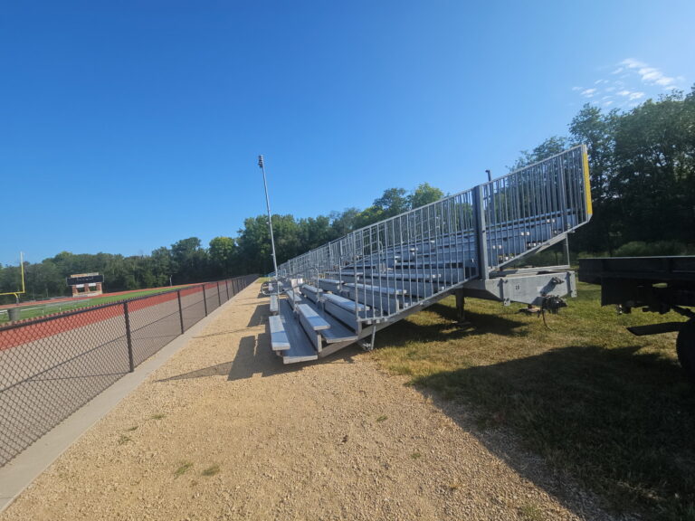 Side view of the rented towable bleachers for a football game at Assumption High School & St. Ambrose University in Davenport, Iowa