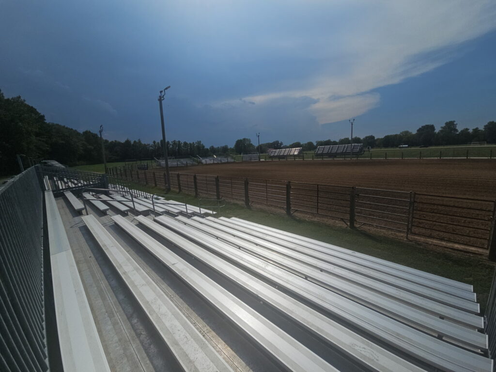 View from 10-row towable bleachers overlooking the Liberty Field rodeo arena in Pacific, Missouri
