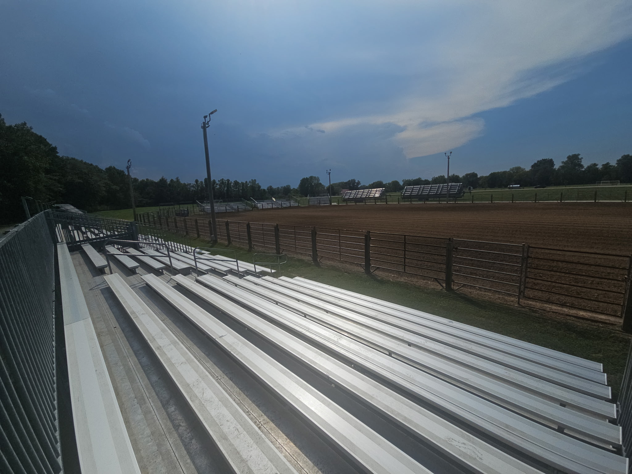 View from 10-row towable bleachers overlooking the Liberty Field rodeo arena in Pacific, Missouri